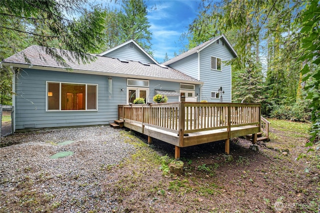 back of house featuring a wooden deck