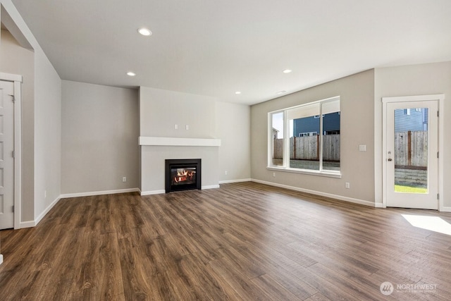 unfurnished living room with dark hardwood / wood-style flooring