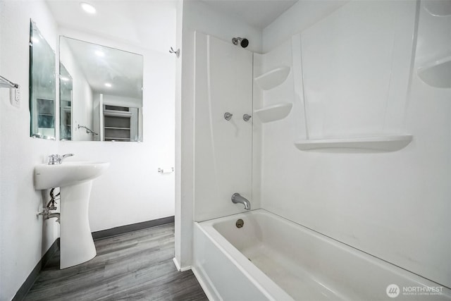 bathroom featuring hardwood / wood-style floors and shower / bathtub combination