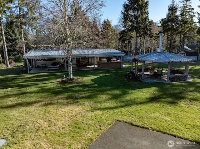 exterior space featuring a lawn, a patio, and a gazebo