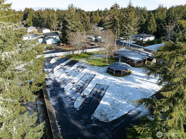 drone / aerial view with a wooded view