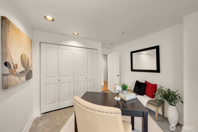 home office with concrete floors, recessed lighting, and baseboards