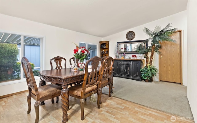 dining room with lofted ceiling