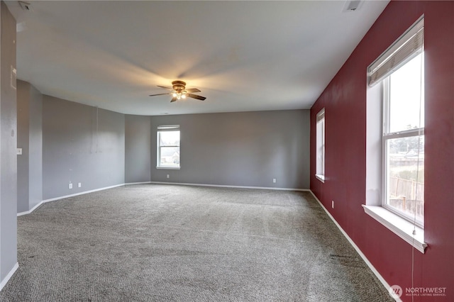 unfurnished room featuring ceiling fan and carpet flooring