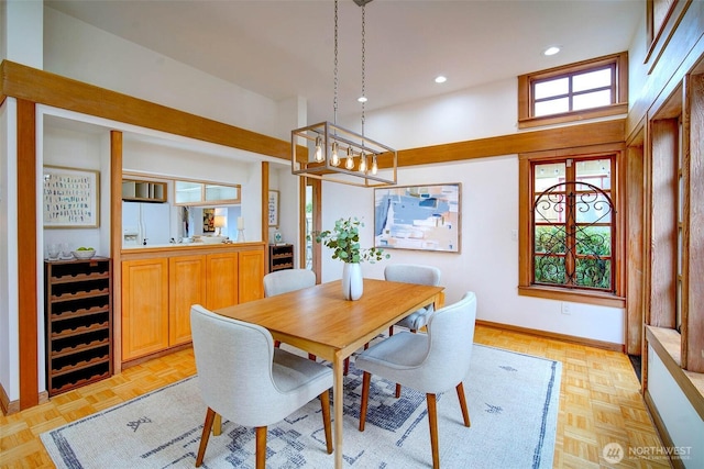 dining area featuring baseboards and recessed lighting