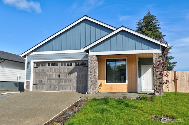 view of front of home featuring a front yard, a garage, and a porch