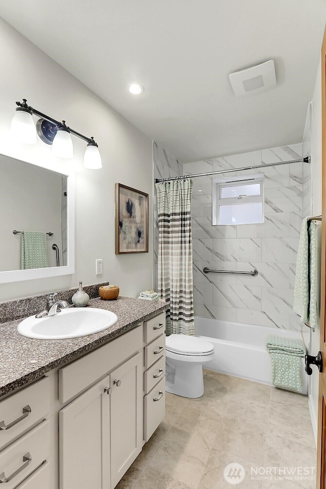 full bathroom featuring toilet, shower / tub combo, and vanity