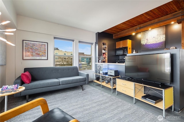 living area featuring wood ceiling and finished concrete flooring