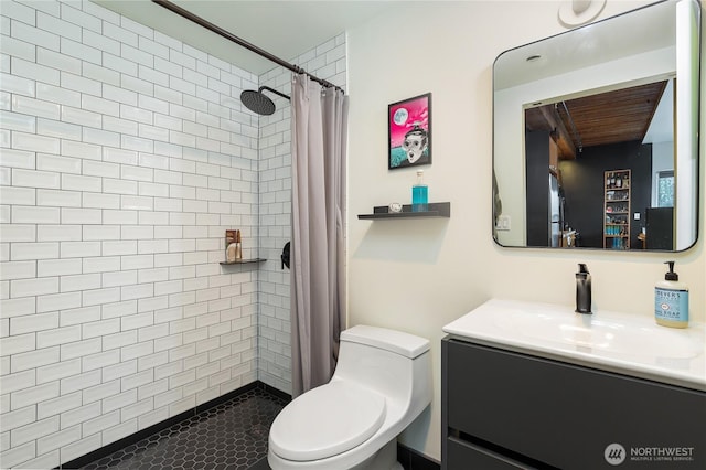 full bath featuring a tile shower, wooden ceiling, vanity, and toilet