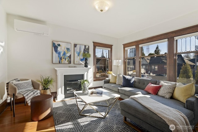 living room featuring a wall unit AC and wood-type flooring