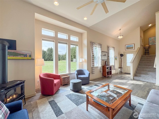 living area with recessed lighting, wood finished floors, stairs, and ceiling fan