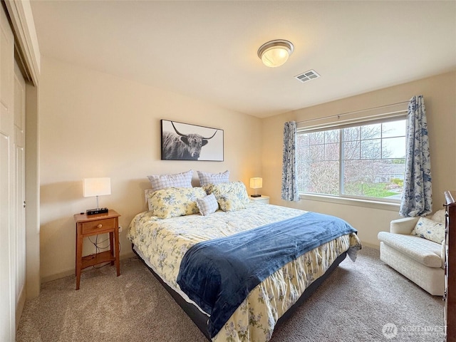 carpeted bedroom with visible vents