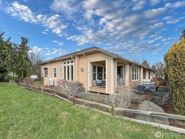 view of side of property with a yard