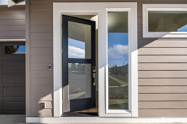 property entrance with a garage