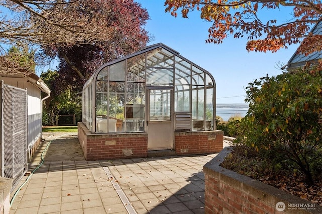 4801 Hyada Blvd NE, Tacoma, WA 98422 - view of patio / terrace featuring an outdoor structure and a greenhouse
