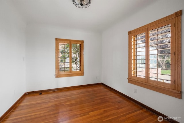 4801 Hyada Blvd NE, Tacoma, WA 98422 - spare room with baseboards and wood finished floors