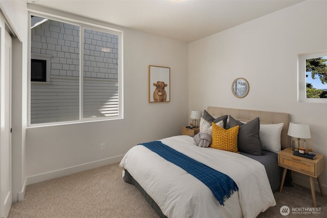 bedroom featuring light colored carpet