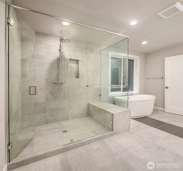 bathroom with visible vents, tile patterned flooring, recessed lighting, a freestanding bath, and a stall shower