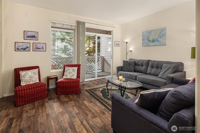 living room featuring dark wood finished floors and baseboards