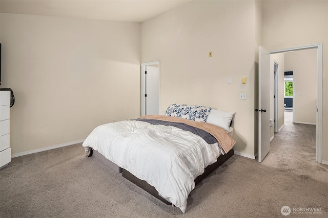 bedroom with high vaulted ceiling, carpet, and baseboards