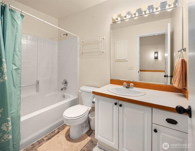 full bathroom featuring toilet, shower / tub combo with curtain, and vanity