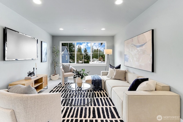 carpeted living room with recessed lighting