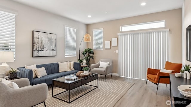 living room with light hardwood / wood-style flooring