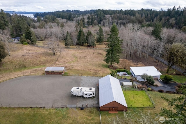 bird's eye view featuring a rural view and a view of trees