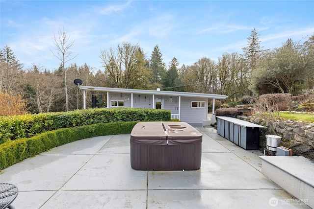 view of patio / terrace featuring a hot tub