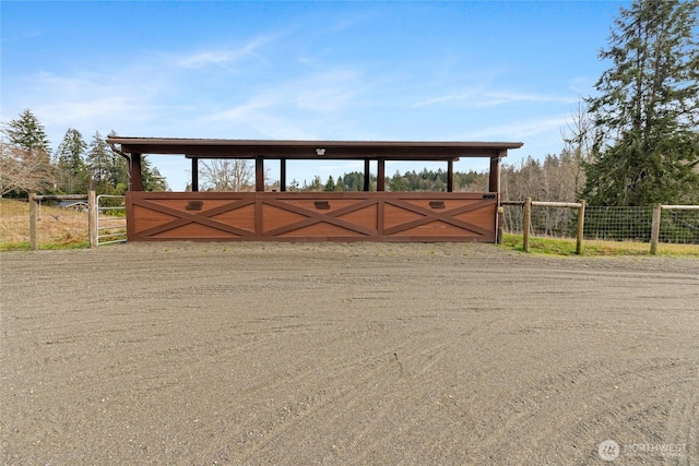 view of gate featuring fence