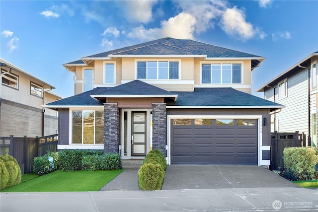 prairie-style home featuring a garage