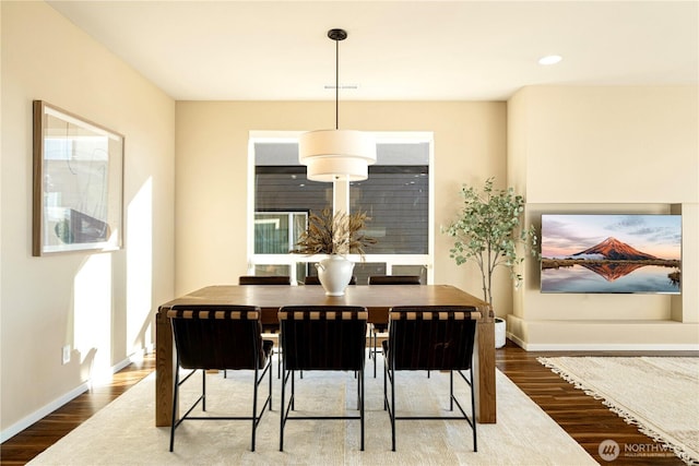 dining space featuring hardwood / wood-style floors