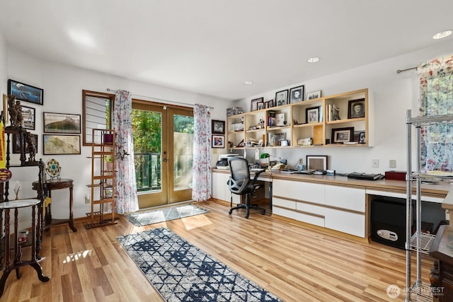 home office featuring french doors, built in desk, recessed lighting, and light wood-style floors