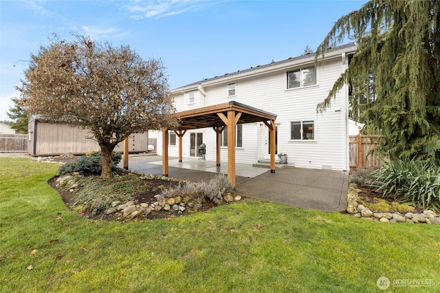 rear view of property with a patio area, fence, and a yard