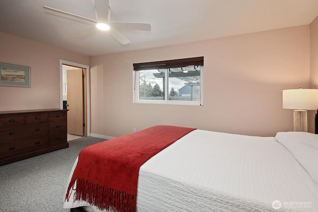 bedroom with a ceiling fan and light colored carpet