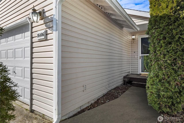 view of property exterior featuring a garage