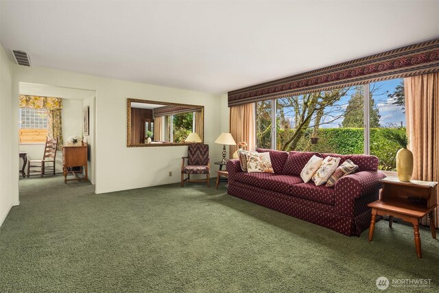 carpeted living room featuring visible vents