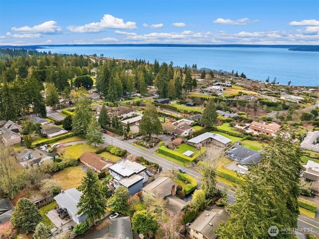 bird's eye view featuring a water view and a residential view