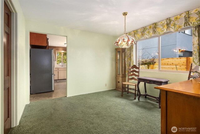 dining room with dark colored carpet