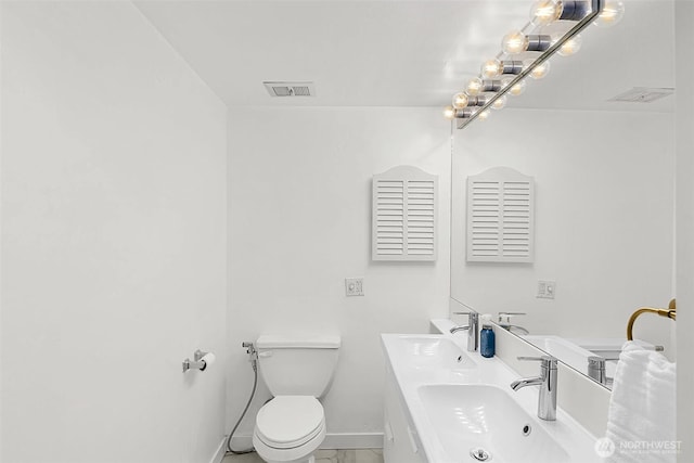 bathroom featuring sink and toilet