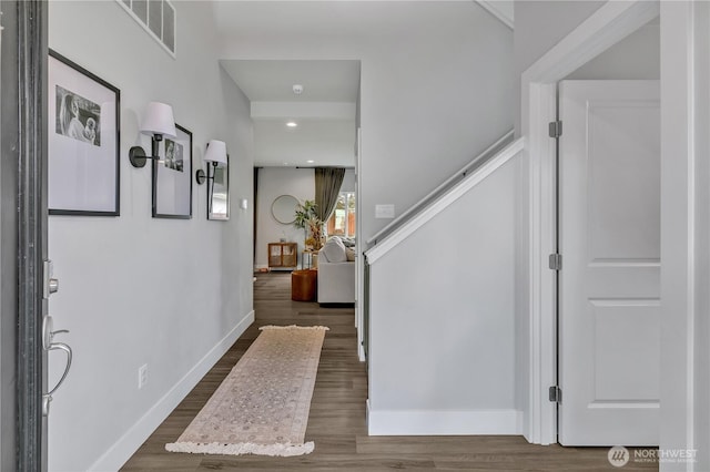 entrance foyer with dark wood-type flooring, recessed lighting, visible vents, and baseboards