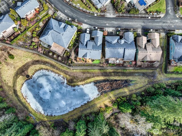 birds eye view of property with a residential view