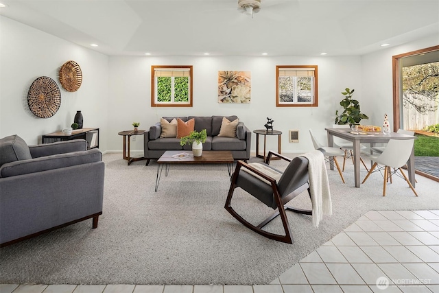 living room with recessed lighting, light colored carpet, and visible vents