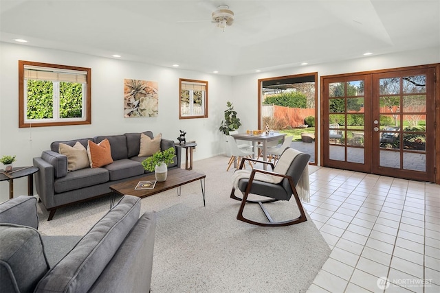 living area featuring recessed lighting, french doors, and light tile patterned floors