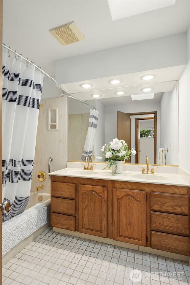 full bath with double vanity, shower / bath combo, a sink, and visible vents