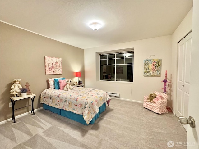 bedroom with carpet floors, a baseboard radiator, and a closet