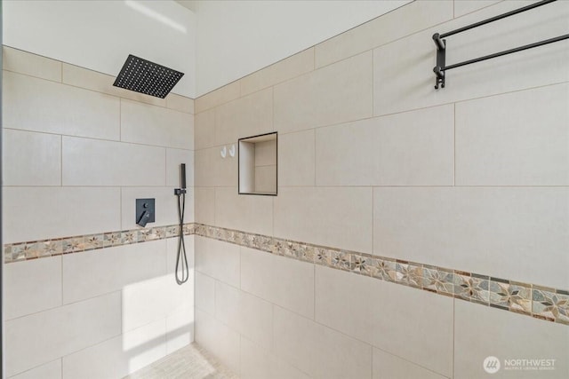 bathroom featuring a tile shower