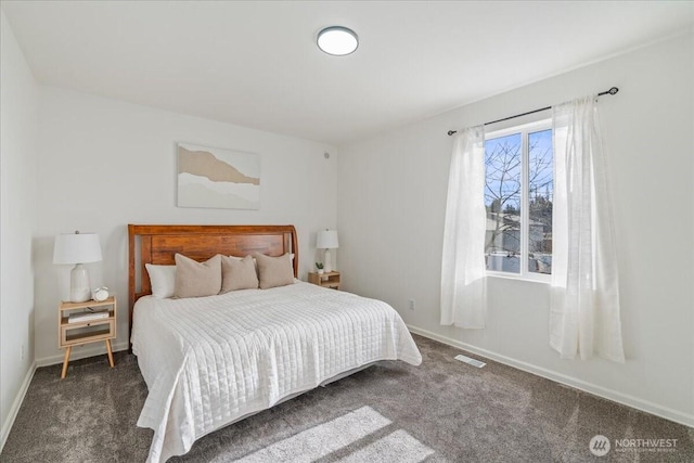 bedroom featuring dark carpet