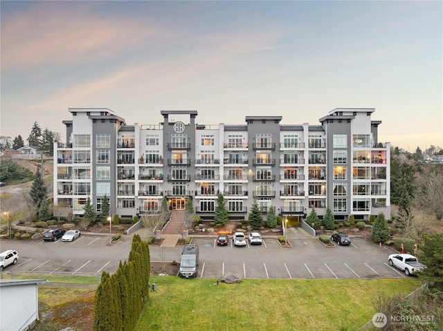 320 E 32nd St Unit 202, Tacoma, WA 98404 - property at dusk with uncovered parking