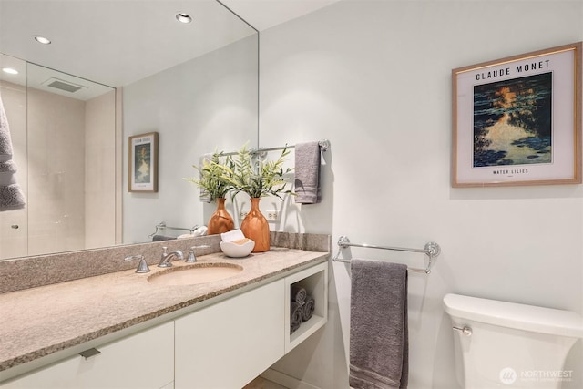 bathroom featuring recessed lighting, visible vents, vanity, and toilet